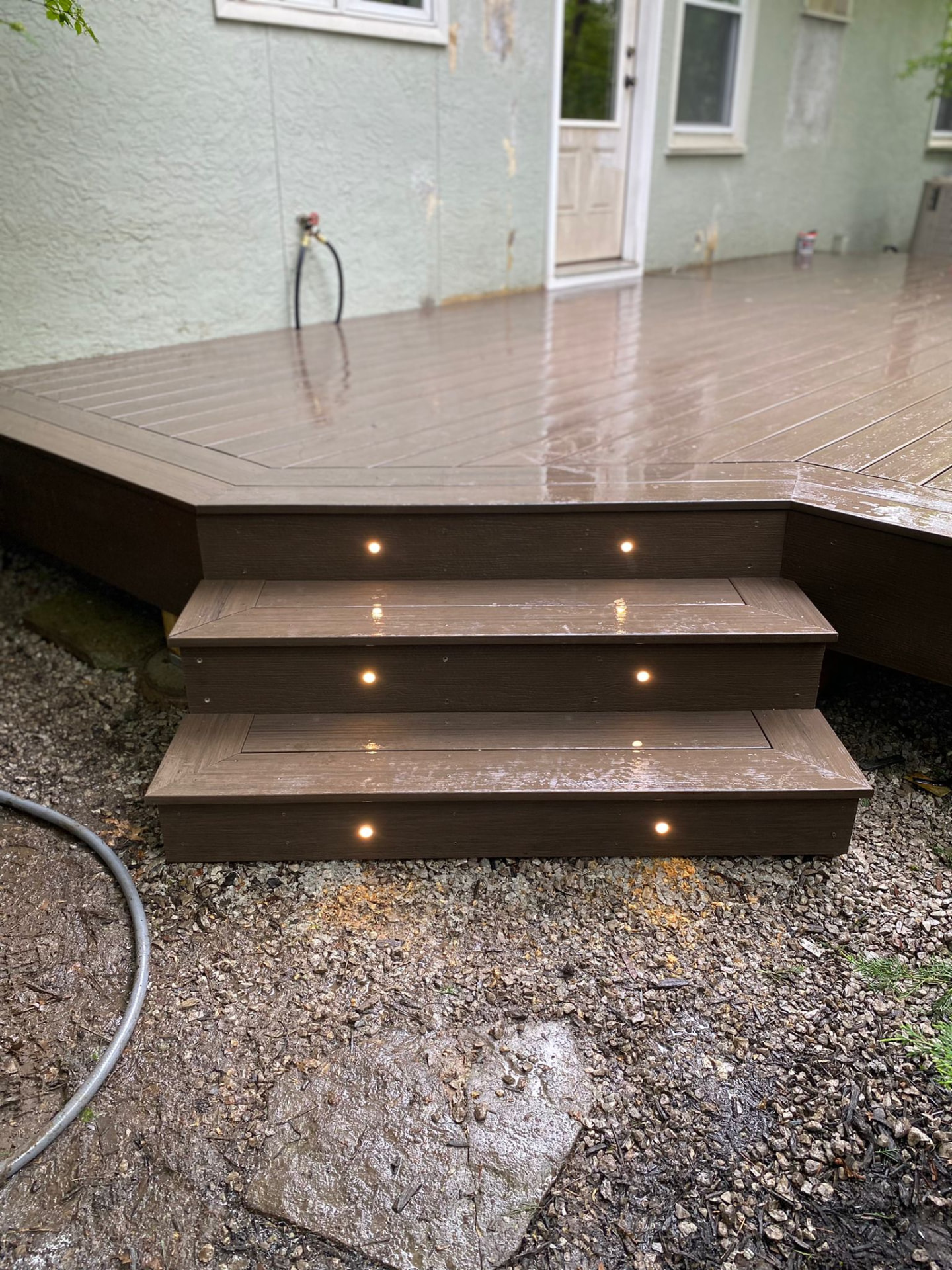 Low composite deck steps with recessed riser lighting
